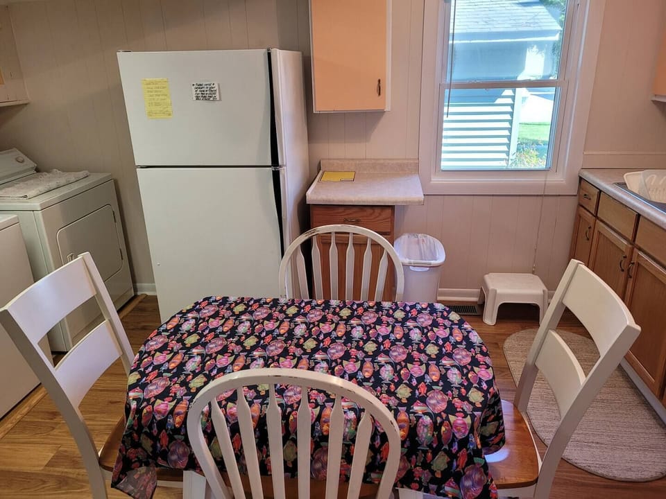 KITCHEN AND DINING AREA:  Full kitchen with a good supply of cooking and dining utensils.  Also includes dining area and washer and dryer.