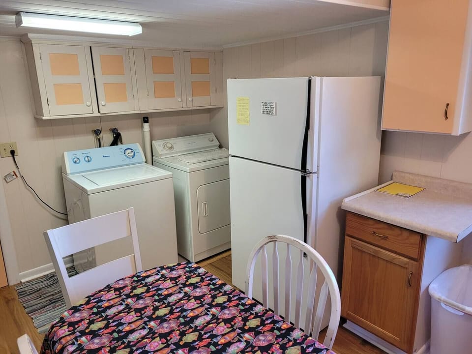KITCHEN AND DINING AREA:  Full kitchen with a good supply of cooking and dining utensils.  Also includes dining area and washer and dryer.
