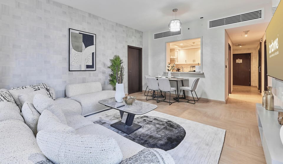 Superior Apartment | Living area | 65-inch flat-screen TV with satellite channels