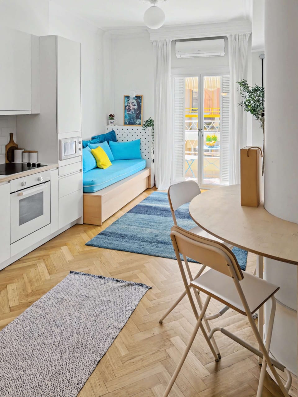 Stylish living and dining area with contemporary design and harmonious tones. Perfect for relaxing moments or private meals, offering comfort and a sense of understated luxury in every detail, making guests feel at home in an elegant setting.
