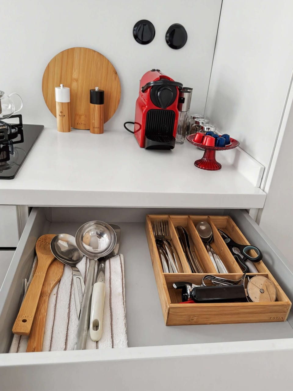 "It is all in the details. Enjoy a thoughtfully curated kitchen setup complete with modern spice grinders and quality wooden boards, ready for your morning coffee rituals or gourmet cooking."