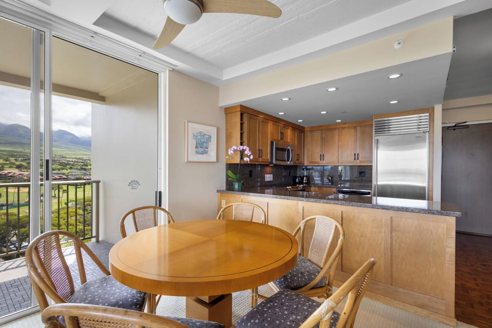 Enjoy meals with stunning mountain views from your spacious dining area and modern kitchen with granite counters and stainless appliances.