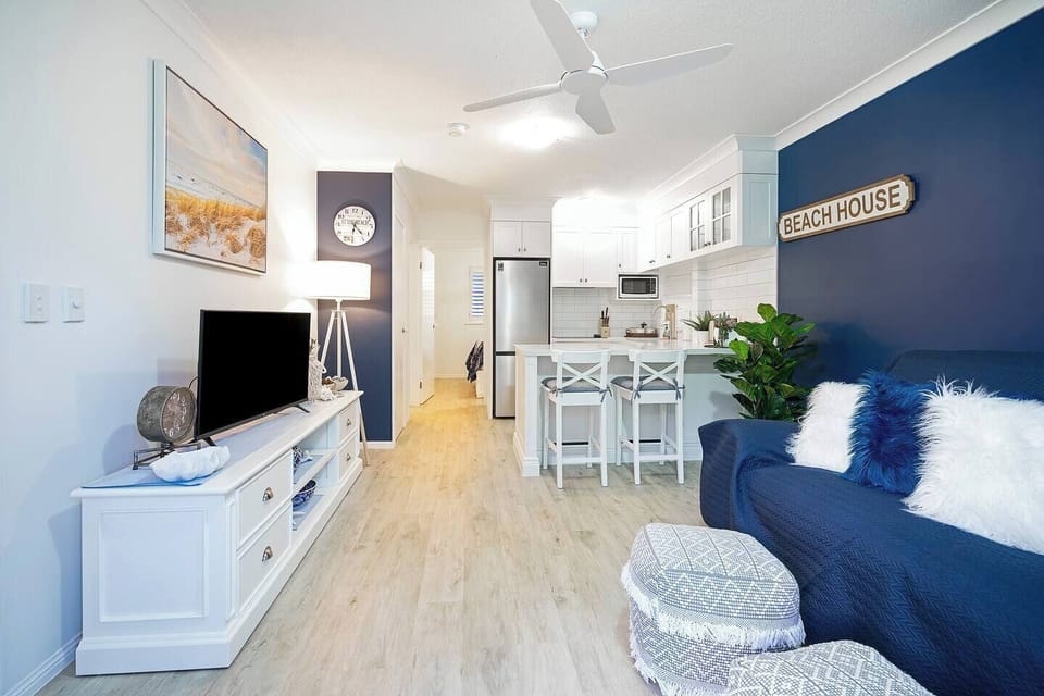  A welcoming, open-plan layout offers casual dining on the breakfast bar. 
