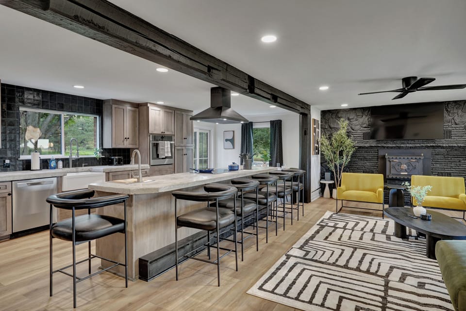 Spacious chef’s kitchen with oversized island and seating for the group.