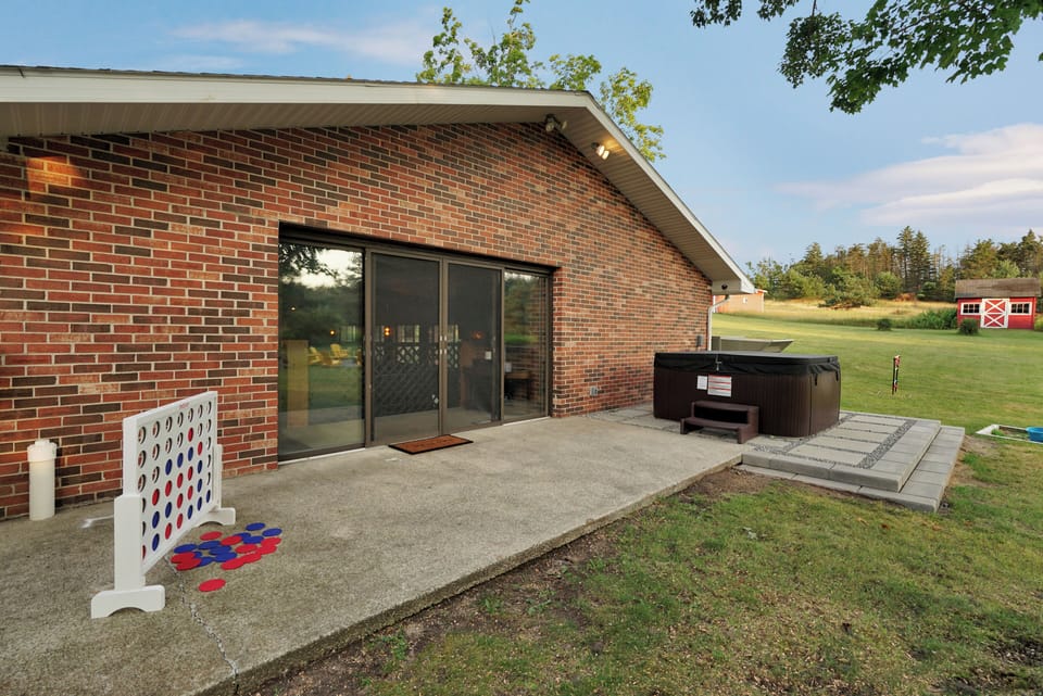 Back patio with direct access to indoor entertainment spaces.