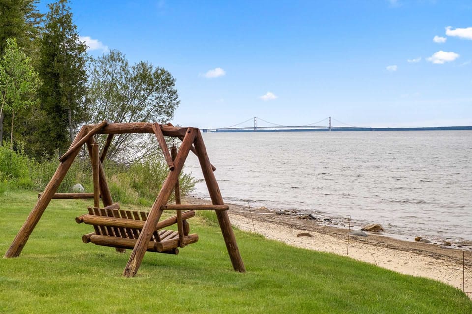 Unwind with stunning views of Mackinac Bridge from the shoreline swing — perfect for coffee or wine time