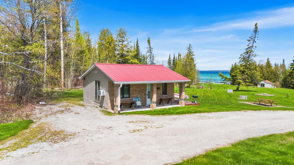 Welcome to Little Lems — your cozy cabin with beach access, firepit, and space to relax on 5 shared lakefront acres