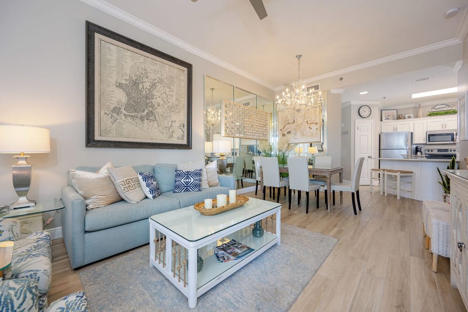 Gather in the inviting living area, surrounded by elegant decor, for cozy conversations and joyful laughter