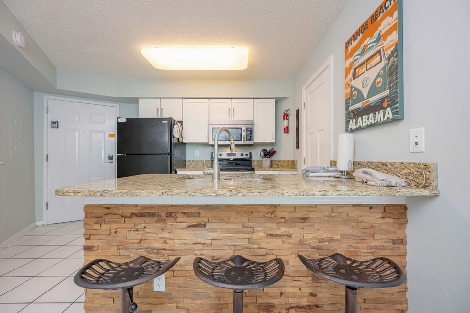 Rustic breakfast bar invites you to enjoy morning coffee while the kitchen hums quietly behind you