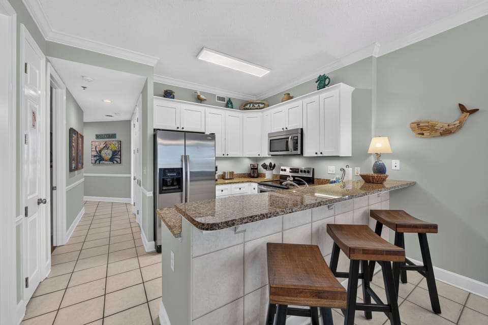 Kitchen - fully stocked with granite tops.