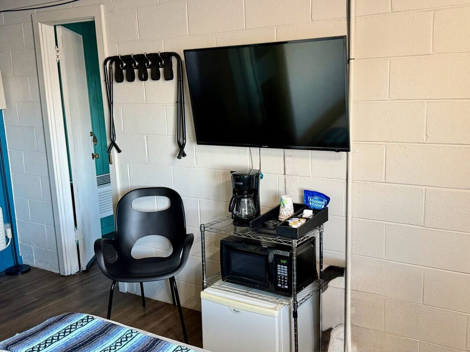 In-room coffee station with mini fridge and microwave — everything you need