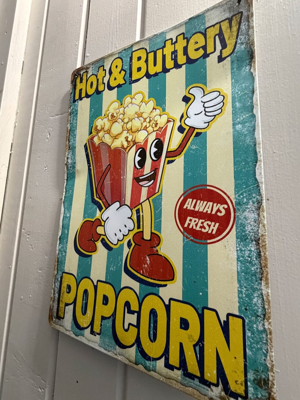Retro popcorn sign adds classic movie theater charm
