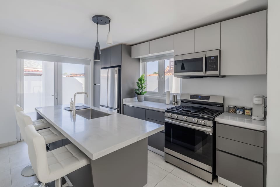 Bright, modern kitchen; fully equipped for your stay.