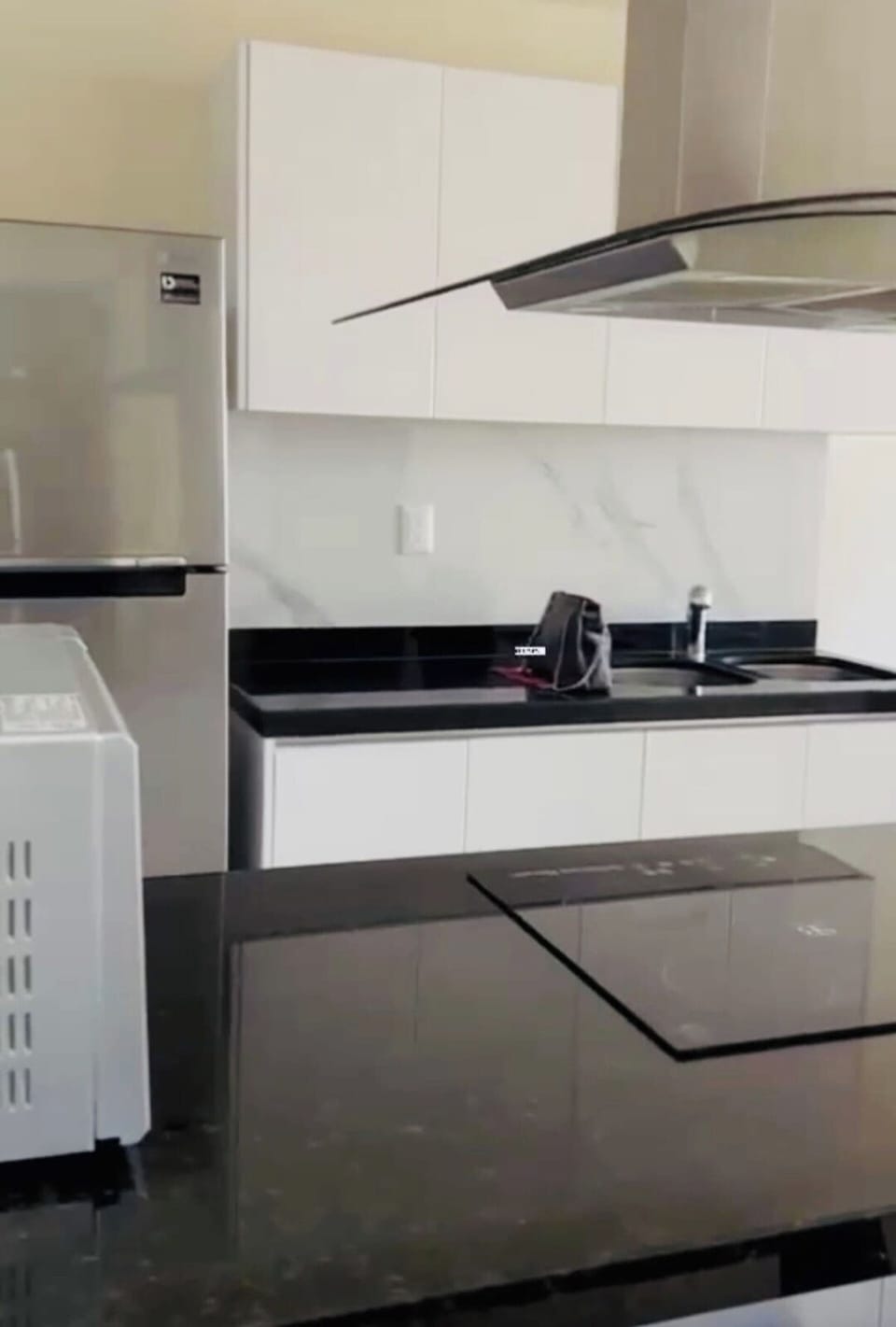 Fully equipped kitchen with nice and clean dinning set, wine glasses and utensils.