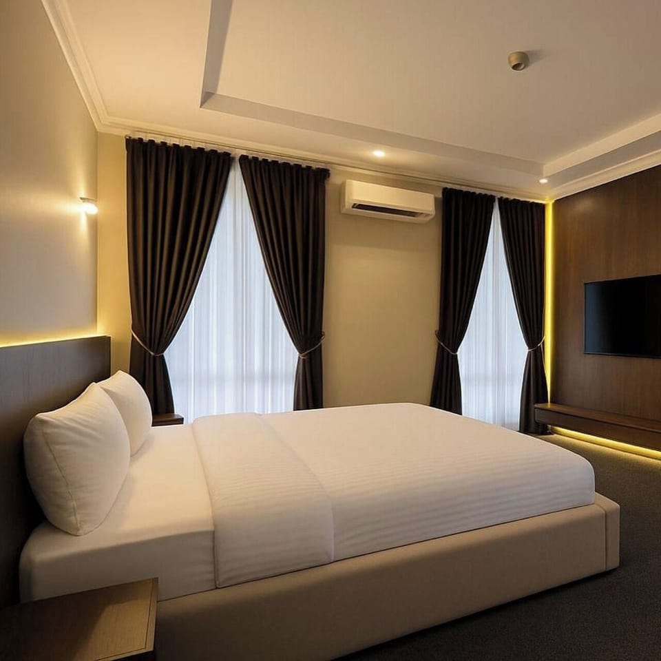 Economy Room, Balcony, City View | Desk, laptop workspace, blackout drapes, soundproofing