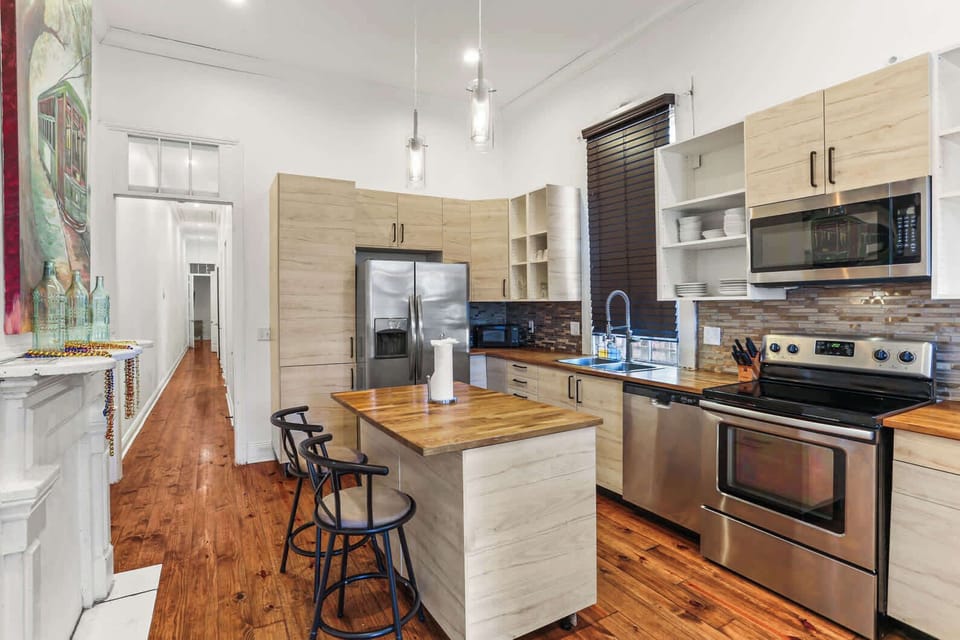 Spacious kitchen with modern appliances, a large island, and bar seating—great for cooking and gathering.