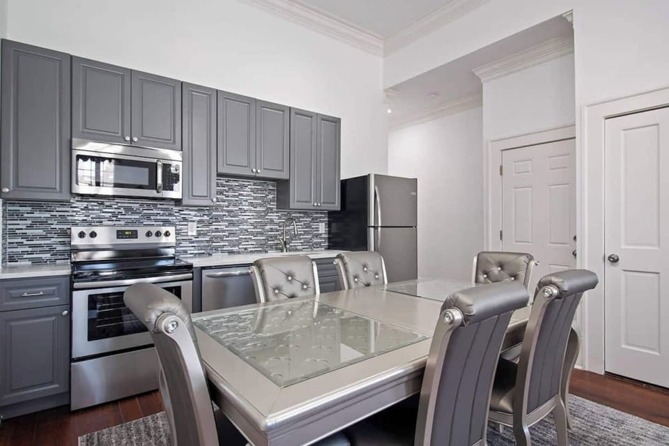 Modern kitchen and dining area with everything you need to cook, eat, and gather together.