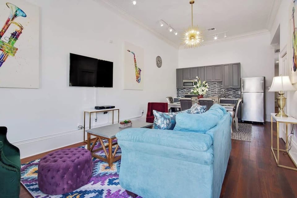 Spacious living area with cozy seating and TV—ideal for group hangouts and downtime.