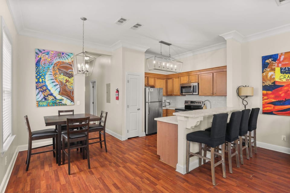 Dining and kitchen area with bar seating—great for shared meals and casual conversations.