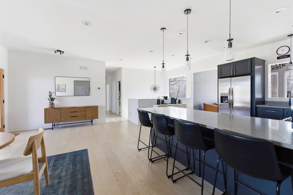 Peninsula seating with additional chairs for easy gathering