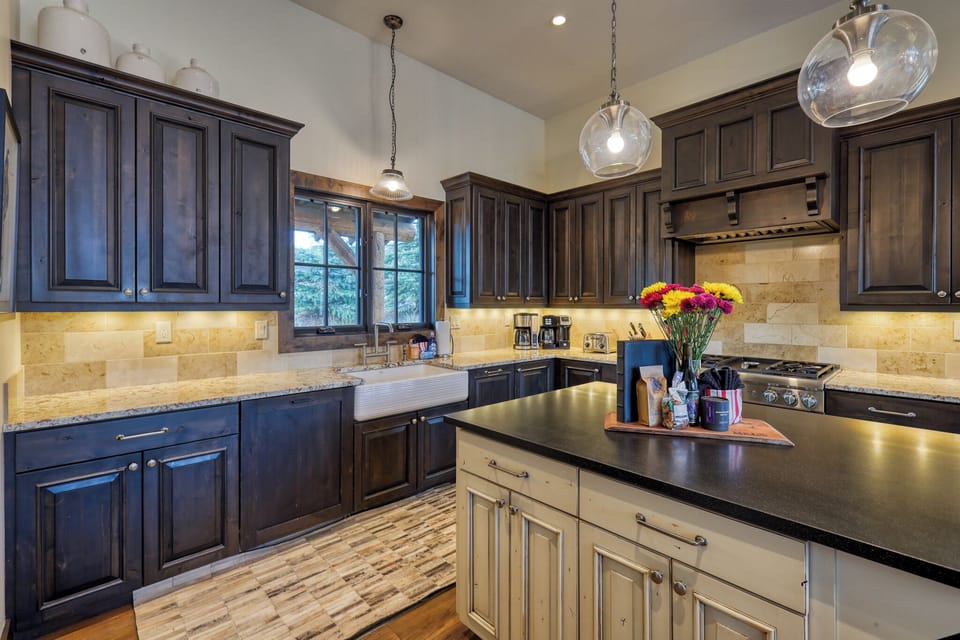 Your gourmet kitchen awaits with elegant granite counters, premium appliances, and warm lighting perfect for memorable culinary adventures.