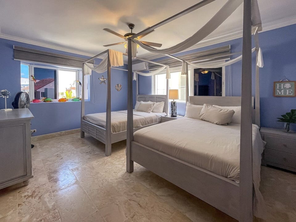 2 queen beds with ensuite bath and TV