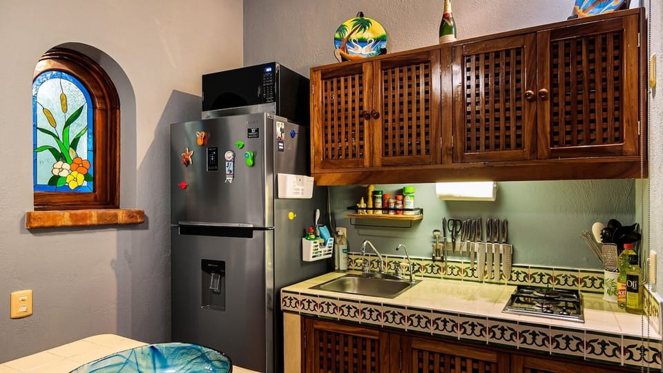 full stocked kitchen and Ref with ice maker 