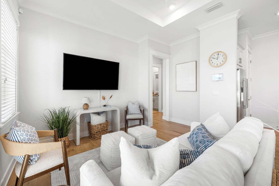 Great room has warm and inviting natural light from wall of windows. Free WiFi.