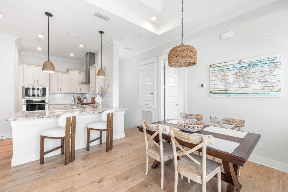 View from dining area into the granite countertops of our spacious full kitchen.