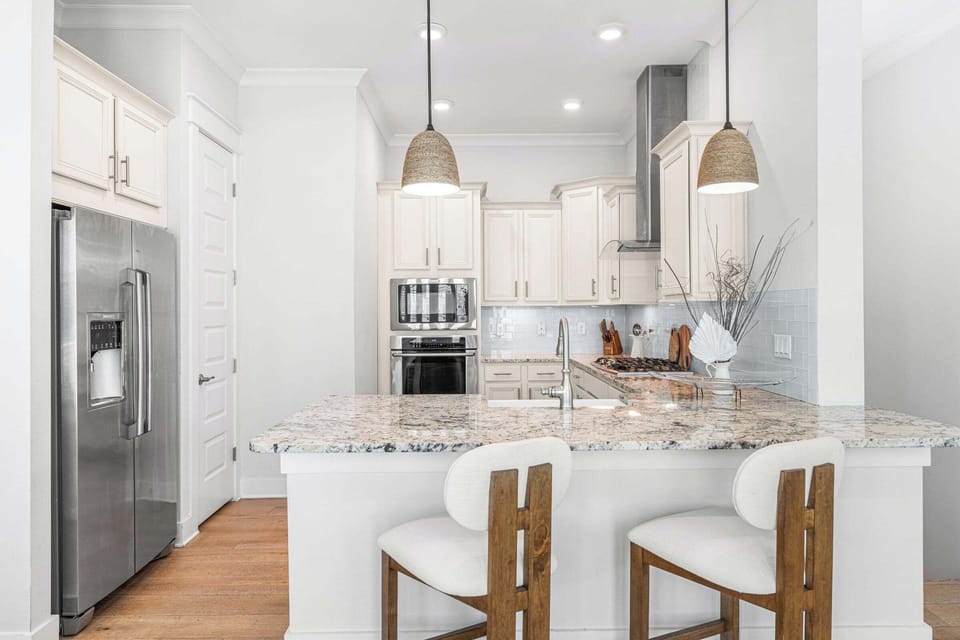 High-end stainless steel appliances, along with large pantry to store dry goods.