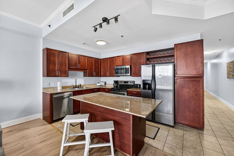 Fully equipped kitchen with granite countertops and stainless steel appliances.