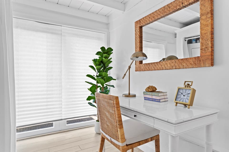 Tropical textures and serene natural light create the perfect spot to unwind or work remotely.