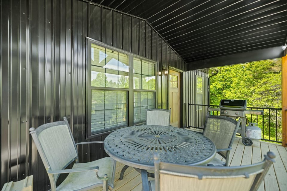 Covered Porch with Gas Grill and Outdoor Dining table.