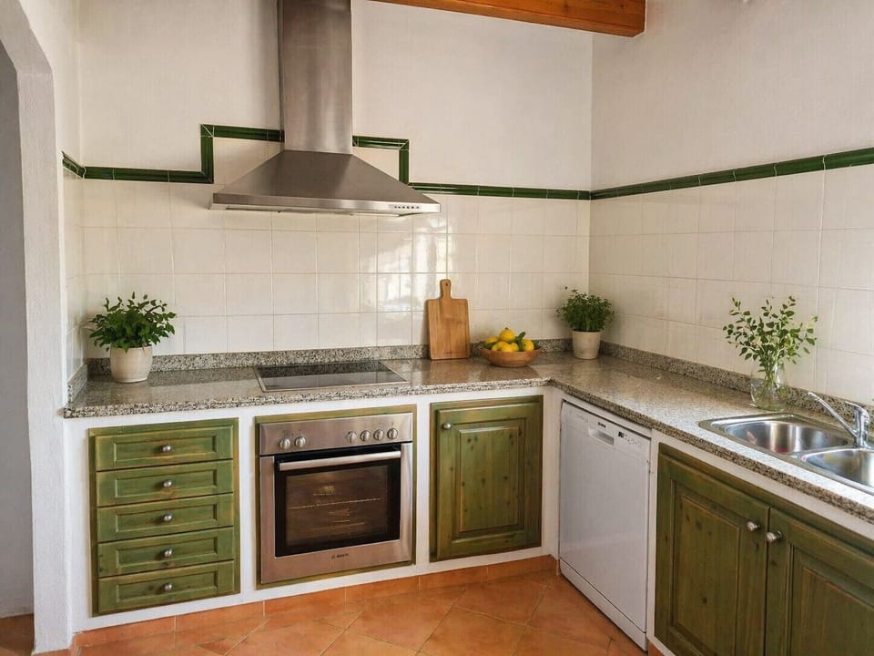 Fully equipped kitchen with oven, dishwasher and countertop in finca in Pollensa