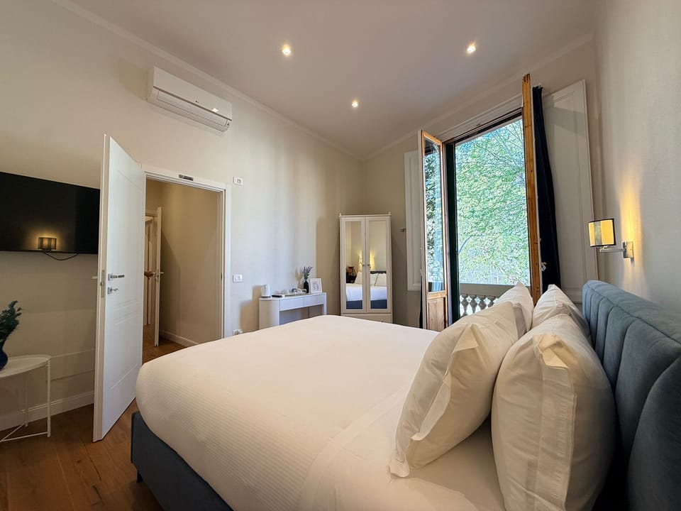 Deluxe Double Room, Balcony | In-room safe, desk, iron/ironing board, free WiFi