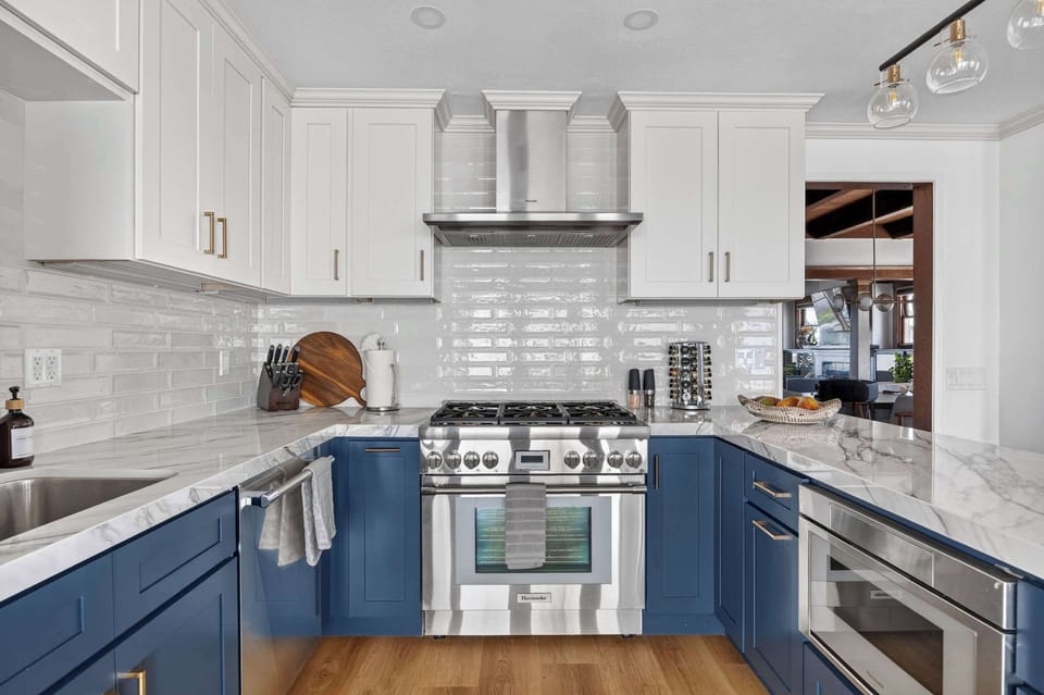 Modern, fully equipped kitchen with sleek finishes and plenty of space to cook and gather.