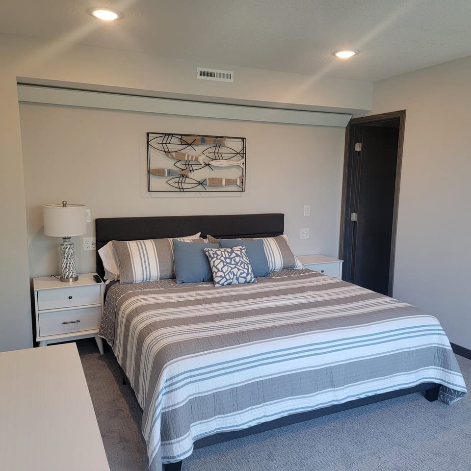 King Bedroom with walk-in closet, bathroom and lake views