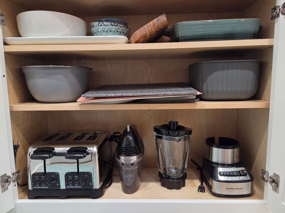 toaster, blender, mixer, bowls, casserole dish, cutting board, platter 