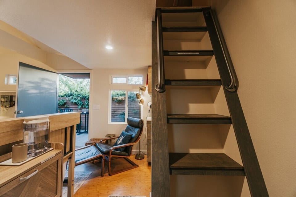 Clean lines and thoughtful transitions. Every detail of this tiny haus is curated to maximize both style and function, guiding you effortlessly up to a peaceful night`s rest.