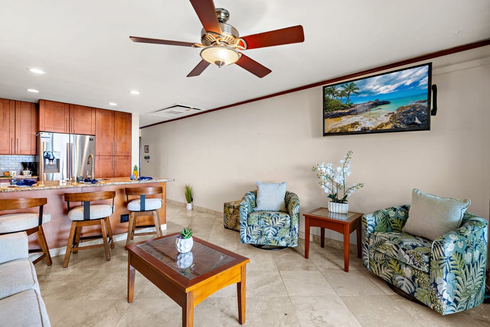 Bright, open-concept living and dining area with tropical touches and comfortable seating.