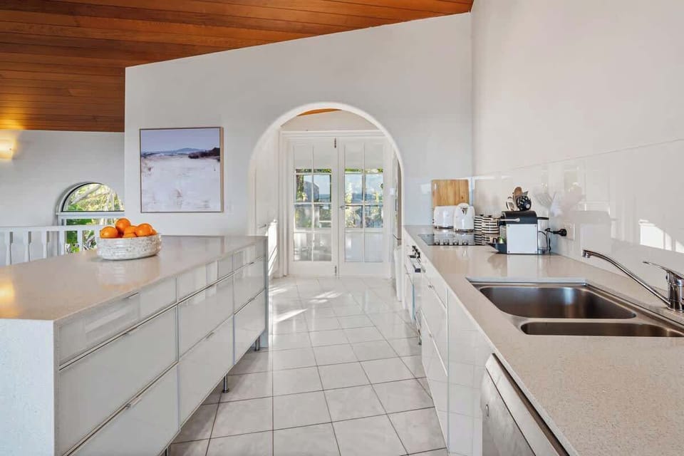 The kitchen is sleek, fully equipped, and ready for relaxed holiday cooking.