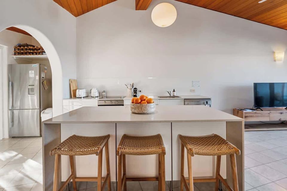 A central island encourages conversations with the cook.