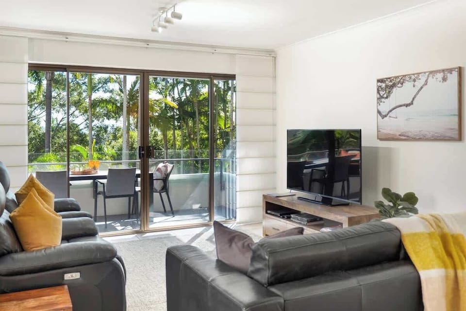 Loungeroom with leafy outlook. 