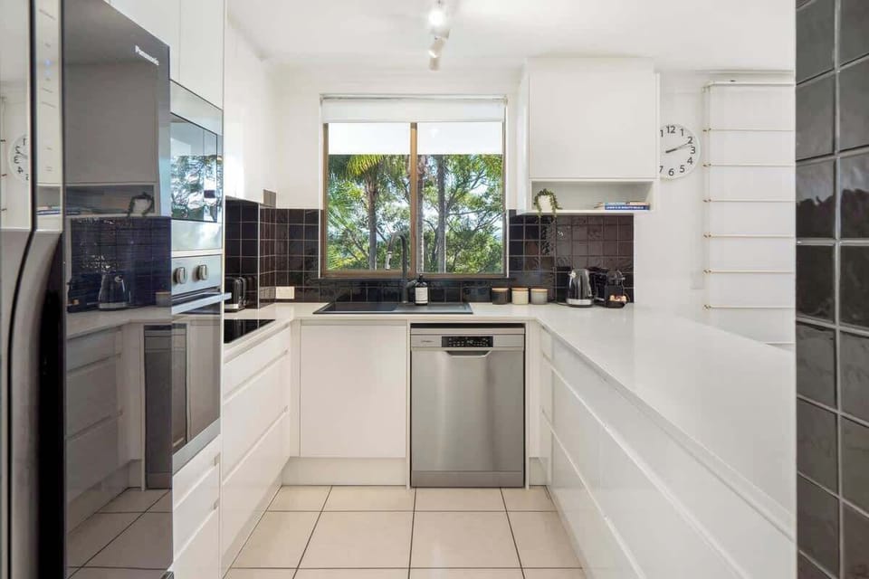 Kitchen with leafy outlook. 