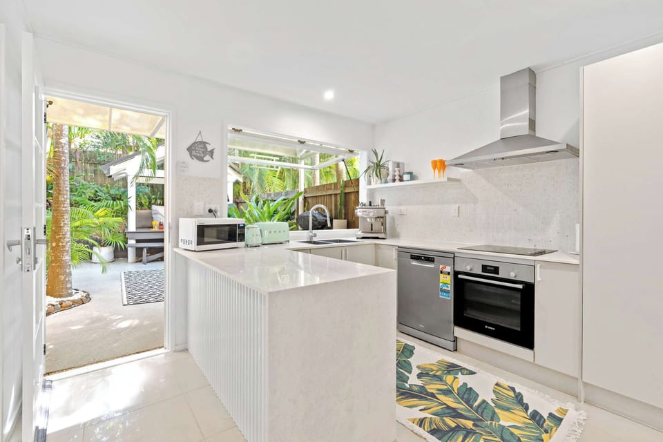Modern kitchen overlooking the dining and living spaces