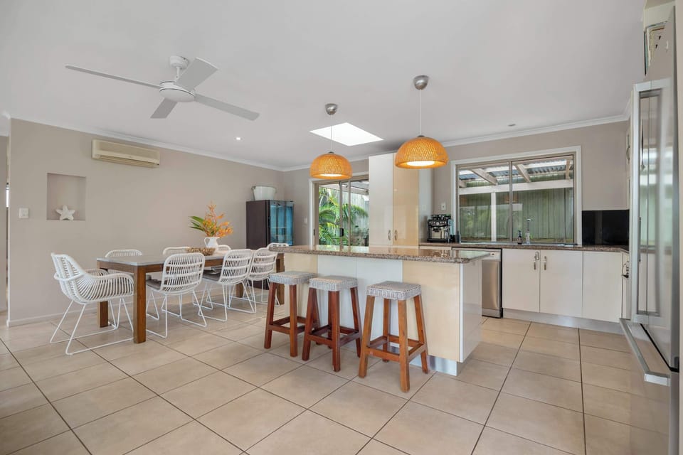 Cook, chat, and connect in the open plan kitchen and dining area— where meals turn into memories.