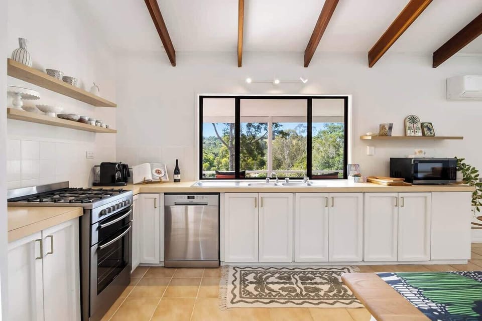 Cook up local Eumundi produce in this breezy country-style kitchen, featuring leafy outlooks and everything you need to feel at home.