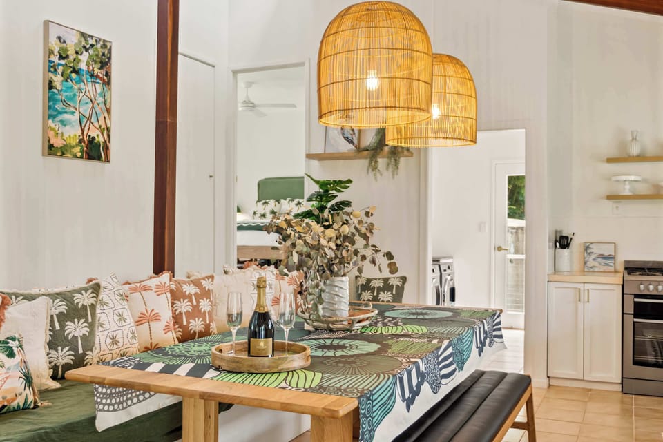 Enjoy the seamless blend of comfort and style, with lush greenery adding a touch of nature to your dining experience.