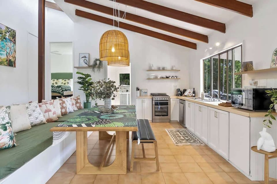 Gather around the built-in dining bench—a space made for shared meals, board games, or laptop time with a view.