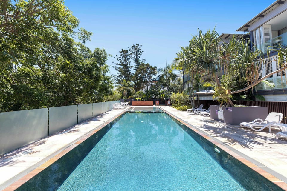 Enjoy access to the spectacular shared heated wet-edge pool, where tropical landscaping creates the perfect setting for a refreshing swim or an afternoon by the water.
